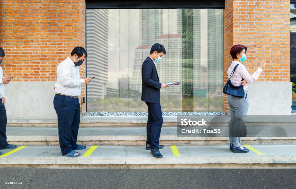 Asian people wearing mask and keep social distancing to avoid the spread of COVID-19 Asian middle aged people wearing mask and keep social distancing to avoid the spread of COVID-19 Social Distancing Stock Photo