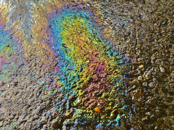 istock Eco concept, oil spill on asphalt road 1221014710