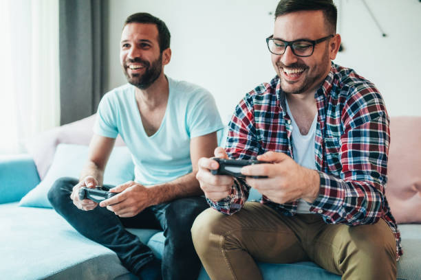 istock Excited friends playing video games 1221016262