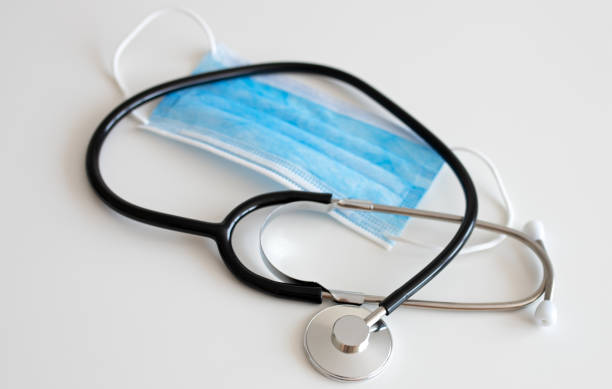 istock Masks and stethoscope on white background 1221020961