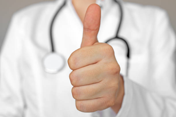 istock Female doctor with thumb up gesture 1221020973