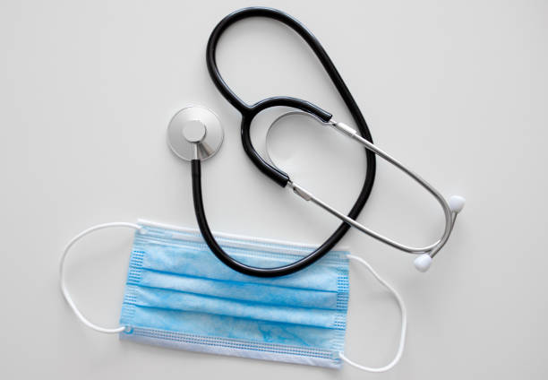 istock Masks and stethoscope on white background 1221021070