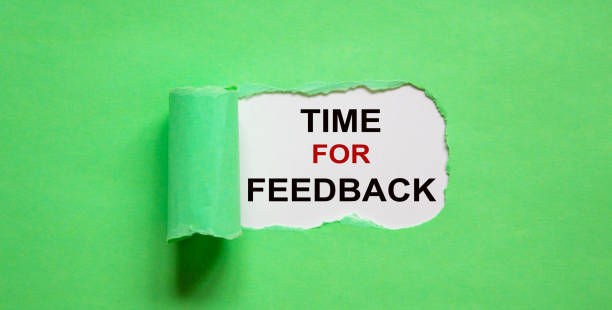 istock The text 'time for feedback' appearing behind torn green paper. 1221021235