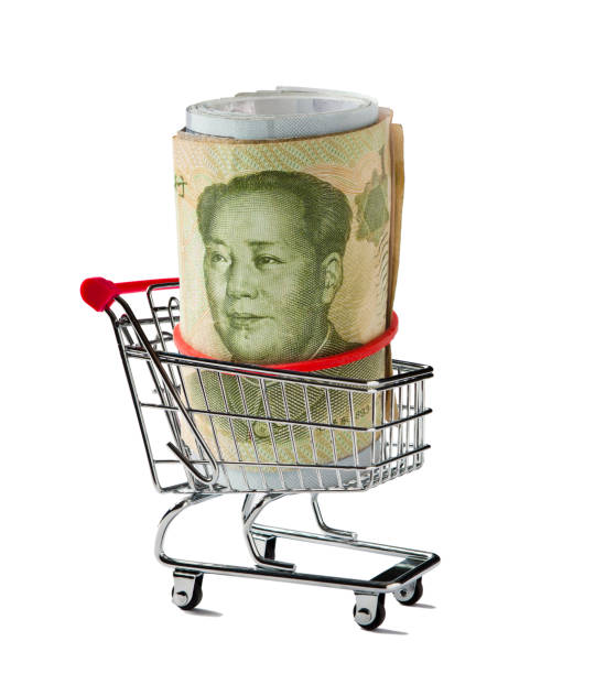 人民元を巻き上げたショッピングカート - three dimensional shape paper currency wealth shopping cart ストックフォトと画像