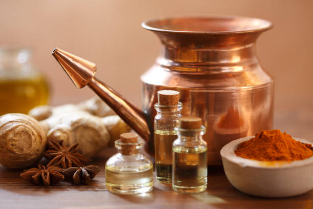 Ayurvedic Copper Neti Pot Neti pots are used for sinus irrigation to help alleviate nasal pressure and congestion. They are also used for keeping away illness during the cold and flu season. ayurveda stock pictures, royalty-free photos & images