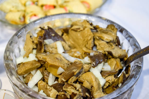 istock Marinated mushrooms with onions in crystal cup. 1221024302