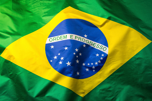 salvador, bahia, brazil - august 25, 2022: Brazil flag on a flagpole of a supermarket in Cabula neighborhood in Salvador city.