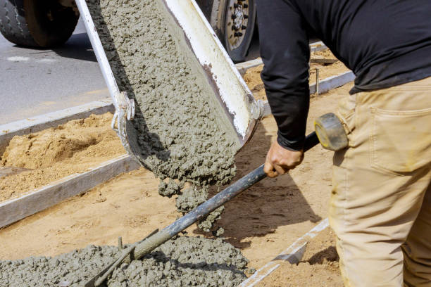 istock Truck mixer pouring concrete cement for construction sidewalk 1221027214