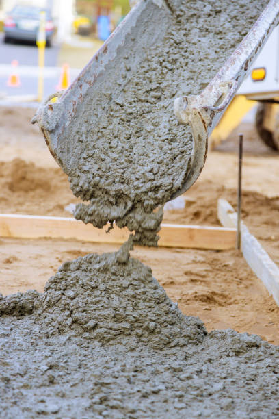istock Pouring concrete with a cement mixer truck construction in the sidewalk 1221027217
