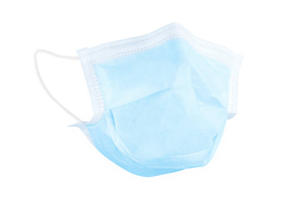 istock Light blue realistic wear medical face mask front view isolated with clipping path 1221027597