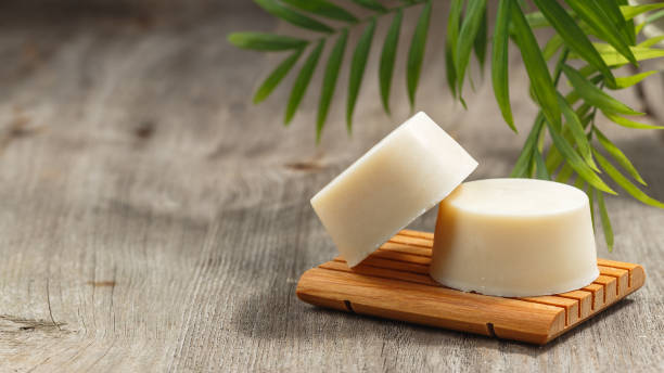 Eco friendly solid shampoo soap bar on wooden dish