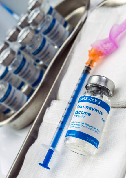 istock Coronavirus covid-19 experimental vaccine in a laboratory, conceptual image 1221032159