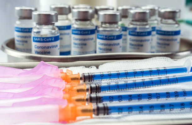 istock Coronavirus covid-19 experimental vaccine in a laboratory, conceptual image 1221032161