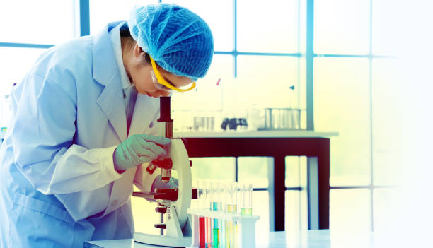 istock Asian scientist or doctors use microscopes to test for the coronavirus (COVID 19). Or a new flu virus to save human life In the lab Or hospital. Successful in researching the treatment of patients 1221032264