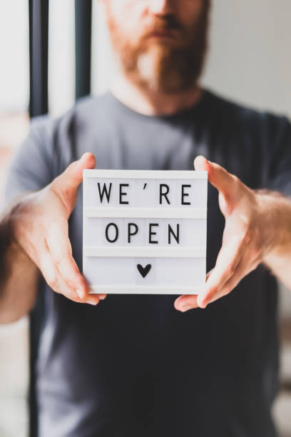 istock End of quarantine. Greeting message We're open 1221032370