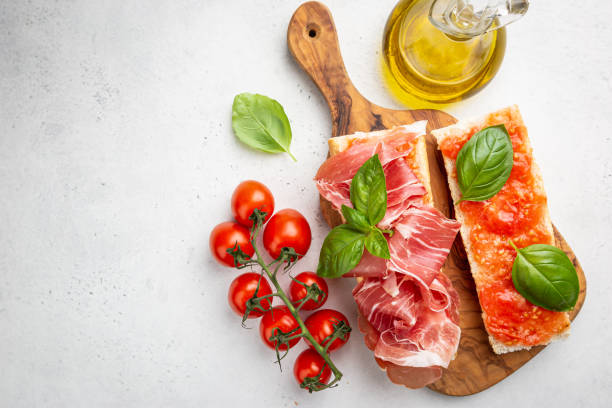 Toast or sandwich with jamon Spanish breakfast, top view. Toast or sandwich with jamon, cheese and tomato sauce spanish breakfast stock pictures, royalty-free photos & images