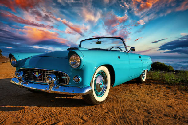 Antique Blue Convertible Ford Thunderbird San Diego, California, United States -August 15th 2015: This is a close up photo of a baby blue 1956 Ford Thunderbird convertible car. This was the first two seat Ford since 1938. This image was shot on the bluff overlooking the Pacific Ocean in North county San Diego on a beautiful sunny day. collectors car stock pictures, royalty-free photos & images