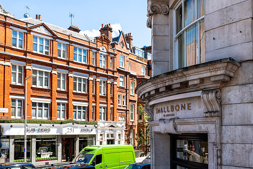 London, UK - June 22, 2018: Neighborhood district of Knightsbridge brick architecture and Smallbone of Devizes sign on building in shopping center