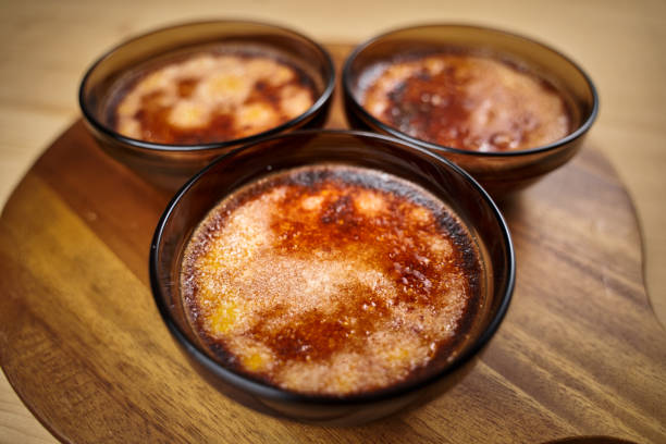 Creme brulee, a delicious French dessert,  on a wooden board