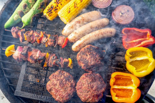 istock A Beautiful Mixed Grill Meat And Fresh Vegetables Arranged On A Charcoal Grill 1221035137