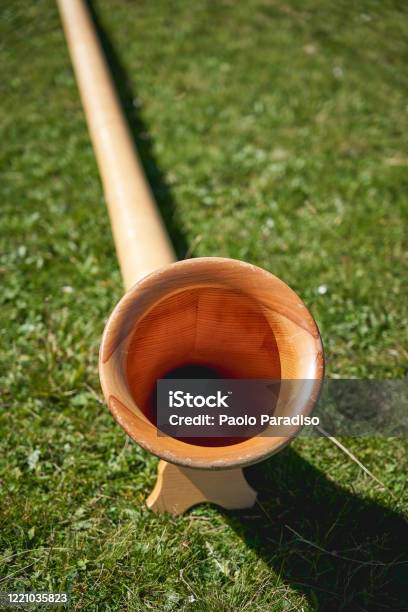 Close Up View Of A Wooden Alpine Horn A Straight Severalmeterlong Wooden Natural Horn Of Conical Bore With A Wooden Cupshaped Mouthpiece Stock Photo - Download Image Now