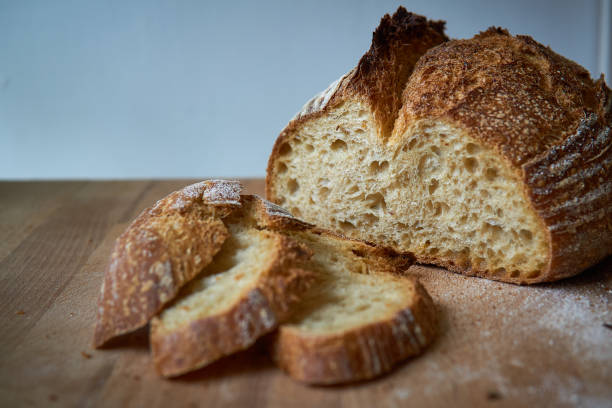 istock Homemade sliced sourdough on a wooden board. 1221036352