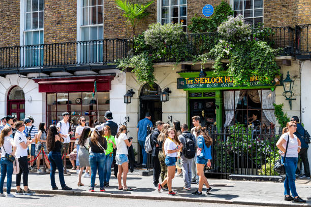 London, UK - June 24, 2018: Downtown during sunny summer day in Marylebone and long line queue crowd by Sherlock Holmes museum