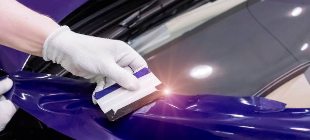 istock Specialist pasting car with vinyl film 1221041783