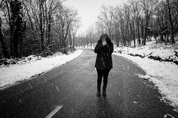istock Snowy forest woman 1221046224