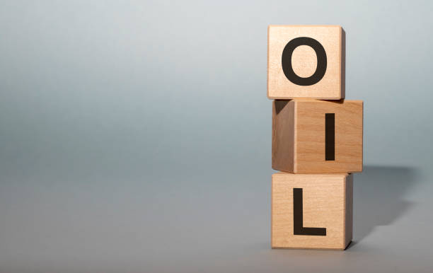 istock word OIL on cube blocks on grey blue background with copy space 1221047927