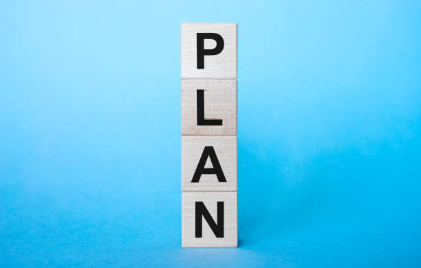 istock PLAN word on a wooden cubes on bright blue background 1221047939