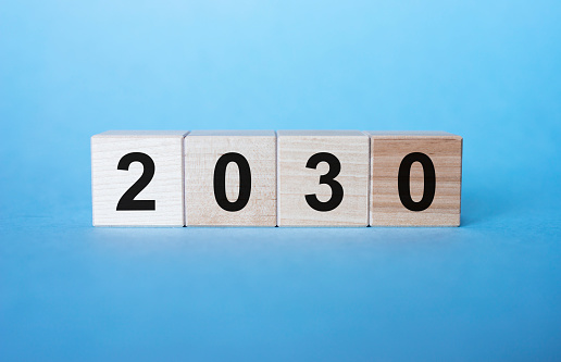 year of 2030 inscription on cubes on light blue background