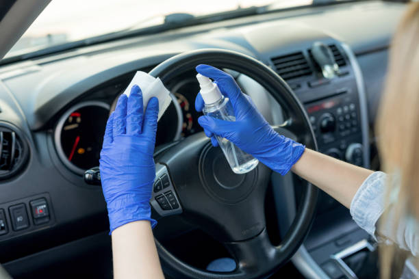 istock Cleaning car steering wheel with wet wipe 1221049202