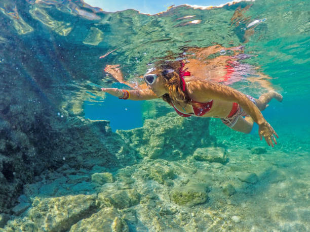 istock Woman floating in the clean sea. 1221050965