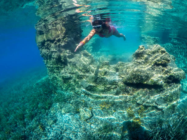 istock Woman floating in the clean sea. 1221051646