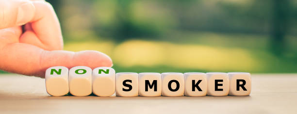 istock Stop smoking concept. Hand turns dice and changes the word 
