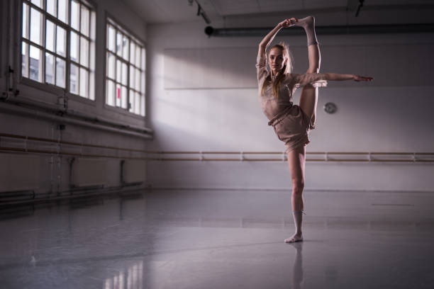 istock Jazzy moves in ballet studio, vertical spilts. 1221052724