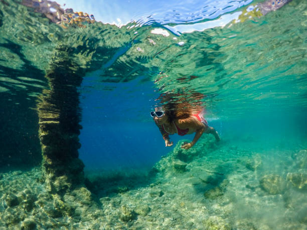istock Woman floating in the clean sea. 1221053898