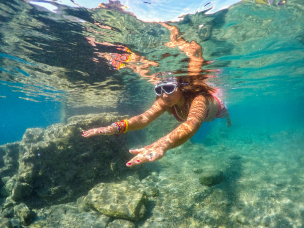 istock Woman floating in the clean sea. 1221054506