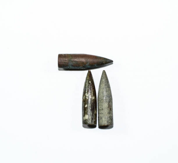 Old rusty bullets from Kalashnikov assault rifle. Old rusty bullets from a Kalashnikov assault rifle. rusty barb stock pictures, royalty-free photos & images