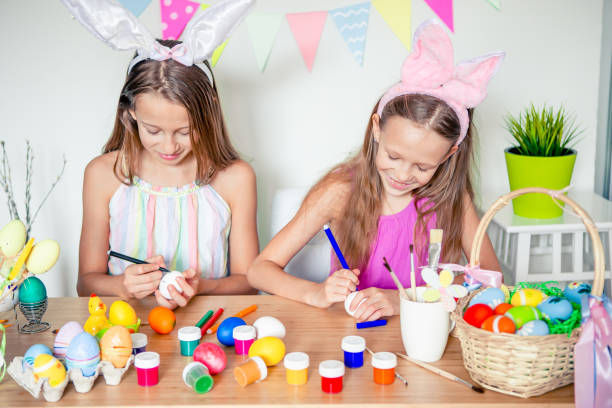 istock Happy easter. Beautiful little kids wearing bunny ears on Easter day. 1221055338