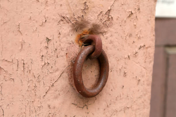 istock Rusty metal ring mounted on the wall of the house 1221058046
