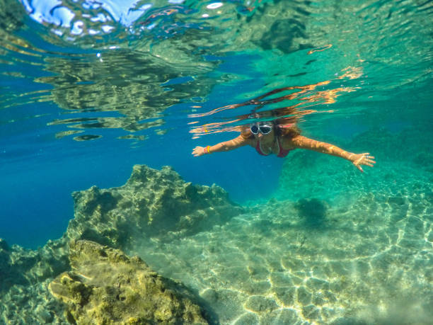 istock Woman floating in the clean sea. 1221058538