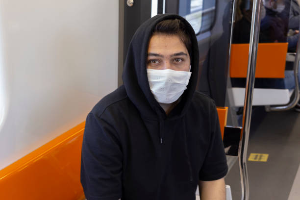istock Young man travels in the subway with a protective mask 1221059771