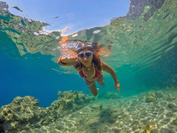 istock Woman floating in the clean sea. 1221062300