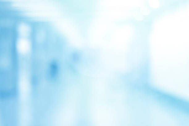 istock Abstract blurred interior of corridor clinic background in blue color , blurry image 1221062568