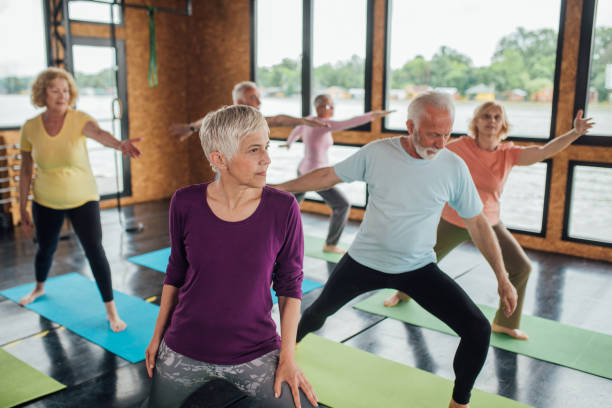 istock Yoga in group for seniors 1221063905