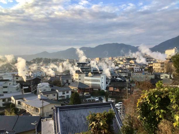 Beppu hot spring town in the morning with rising steam Beppu hot spring town in the morning with rising steam hells of beppu photos stock pictures, royalty-free photos & images
