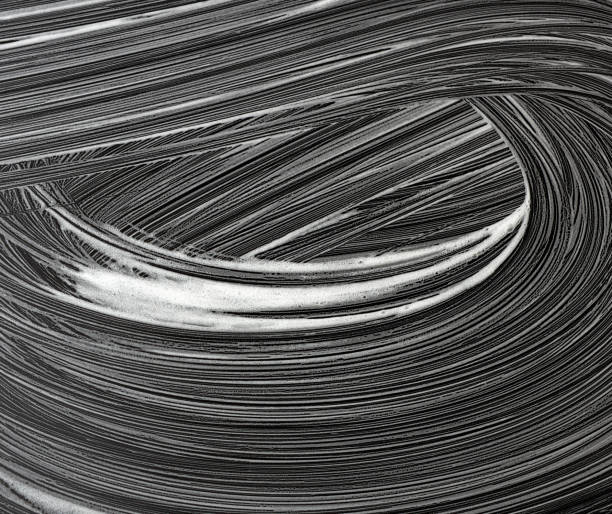 istock white soap foam on a black background, top view, concept of clea 1221065683