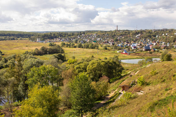 istock Russian landscape with fields, meadows and a village and skyline 1221066947